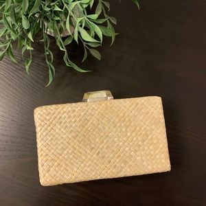 Woven straw clutch with shell clasp